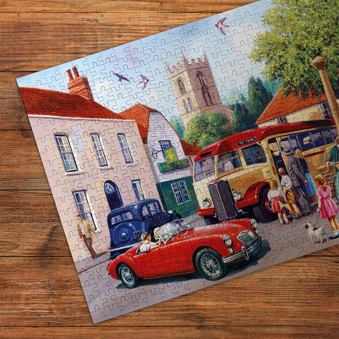 Puzzle in progress: Touring the Town by Kevin Walsh – 500 Piece Jigsaw Puzzle (Gibsons)
